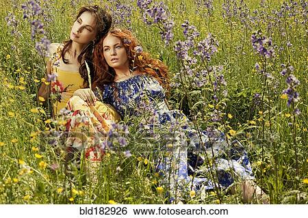 Caucasian women in field of flowers View Large Photo Image Stock Photograph - Caucasian women in field of flowers. Fotosearch