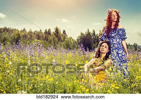 Picture - Caucasian women in rural field. Fotosearch