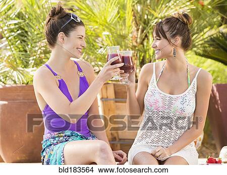 Caucasian women toasting with cocktails View Large Photo Image Picture - Caucasian women toasting with cocktails. Fotosearch