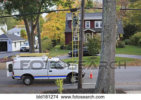 Caucasian worker installing cable on pole View Large Photo Image Picture - Caucasian worker installing cable on pole. Fotosearch