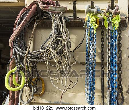 Chains and cords hanging on hooks View Large Photo Image Stock Photography - Chains and cords hanging on hooks. Fotosearch