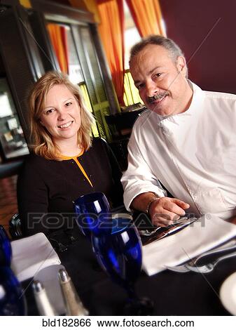 Stock Photograph - Chef and restaurant owner smiling. Fotosearch