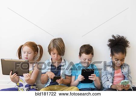Children using technology View Large Photo Image Stock Image - Children using technology. Fotosearch