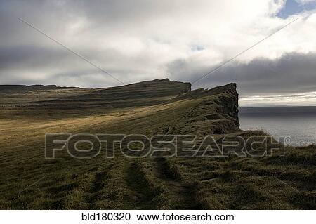 Stock Image - Cliffs over remote beach. Fotosearch