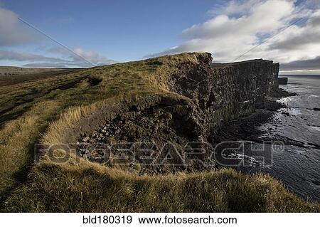 Cliffs over remote beach View Large Photo Image Stock Photo - Cliffs over remote beach. Fotosearch