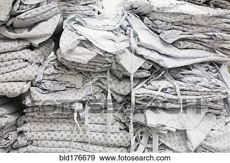 Stock Photo - Close up of folded hospital gowns. Fotosearch