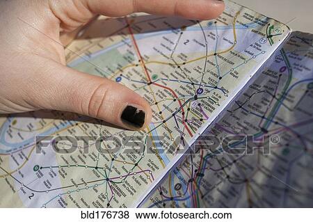 Close up of hand holding Paris city map, Paris, Ile-de-France, France View Large Photo Image Stock Photo - Close up of hand holding Paris city map, Paris, Ile-de-France, France. Fotosearch