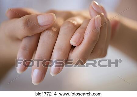 Close up of hands of Hispanic woman View Large Photo Image Picture - Close up of hands of Hispanic woman. Fotosearch