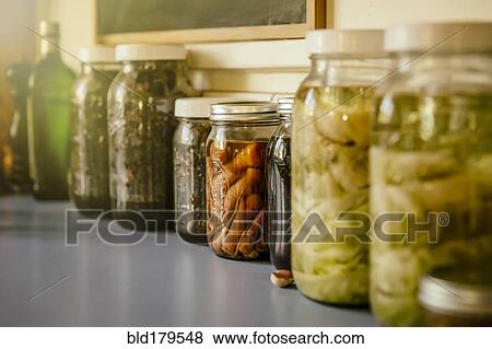 Stock Photo - Close up of jars of preserves. Fotosearch