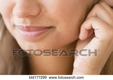 Stock Photo - Close up of lips of mixed race woman. Fotosearch