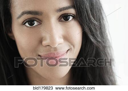 Stock Image - Close up of mixed race woman smiling. Fotosearch