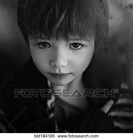 Stock Photography - Close up of sad Caucasian girl looking up. Fotosearch