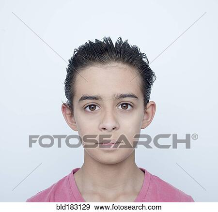 Close up of serious mixed race boy View Large Photo Image Stock Photo - Close up of serious mixed race boy. Fotosearch