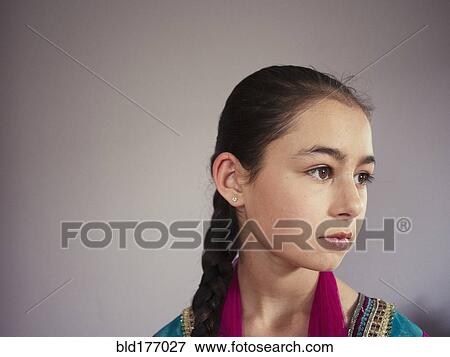 Close up of serious mixed race girl View Large Photo Image Stock Photo - Close up of serious mixed race girl. Fotosearch