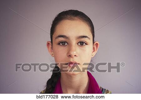 Close up of serious mixed race girl View Large Photo Image Stock Photo - Close up of serious mixed race girl. Fotosearch