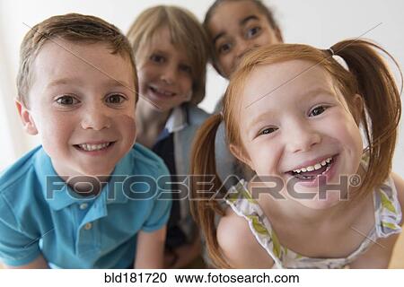 Stock Image - Close up of smiling children. Fotosearch