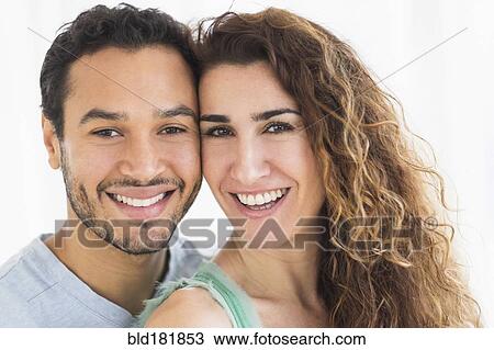 Stock Image - Close up of smiling couple. Fotosearch
