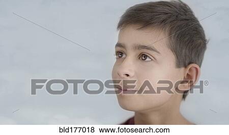 Close up of smiling mixed race boy View Large Photo Image Stock Photo - Close up of smiling mixed race boy. Fotosearch