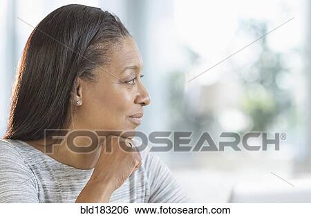 Stock Photograph - Close up of smiling mixed race woman. Fotosearch