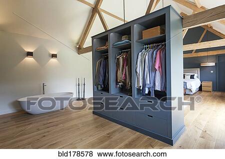 Closet and bathtub in modern bedroom View Large Photo Image Stock Photo - Closet and bathtub in modern bedroom. Fotosearch