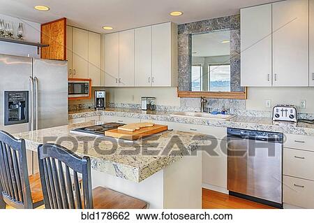 Stock Image - Countertops and cabinets in modern kitchen. Fotosearch