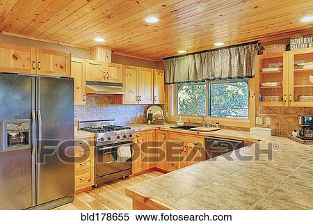 Stock Photography - Countertops and cabinets in rustic kitchen. Fotosearch