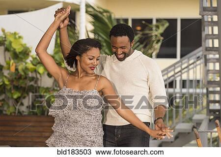 Couple dancing outdoors View Large Photo Image Stock Image - Couple dancing outdoors. Fotosearch