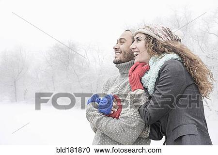 Couple hugging in snow View Large Photo Image Stock Image - Couple hugging in snow. Fotosearch