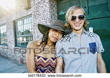 Couple hugging outdoors View Large Photo Image Stock Image - Couple hugging outdoors. Fotosearch