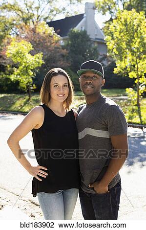 Stock Image - Couple smiling outdoors. Fotosearch