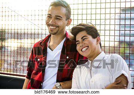 Stock Photo - Couple smiling outdoors. Fotosearch