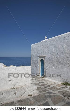 Cross on traditional building under blue sky View Large Photo Image Picture - Cross on traditional building under blue sky. Fotosearch