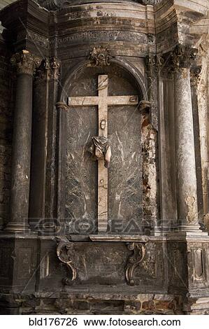 Stock Photograph - Crucifix on church wall above altar. Fotosearch