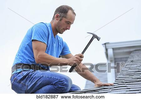 Deaf Caucasian roofer hammering on roof View Large Photo Image Stock Photo - Deaf Caucasian roofer hammering on roof. Fotosearch
