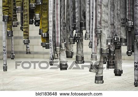 Detail of hanging fire hoses View Large Photo Image Stock Photo - Detail of hanging fire hoses. Fotosearch