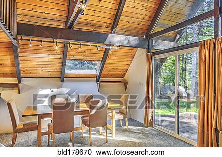Dining table and windows in rustic dining room View Large Photo Image Stock Image - Dining table and windows in rustic dining room. Fotosearch