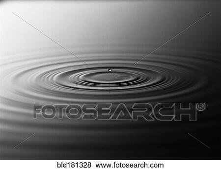 Stock Photo - Droplet splashing in rippling water. Fotosearch