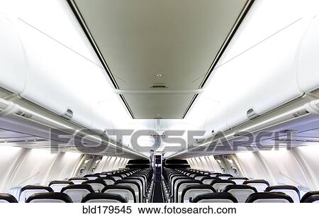 Empty chairs and compartments in airplane View Large Photo Image Stock Photography - Empty chairs and compartments in airplane. Fotosearch