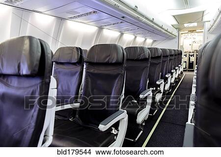 Picture - Empty chairs in airplane. Fotosearch