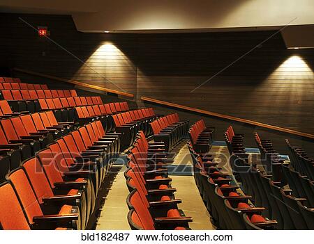 Stock Photo - Empty chairs in movie theater. Fotosearch