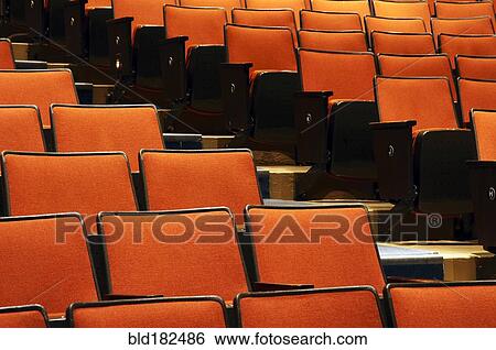Stock Photograph - Empty chairs in movie theater. Fotosearch