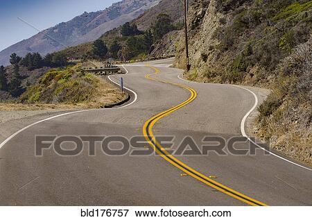 Stock Photo - Empty road on remote hillside. Fotosearch