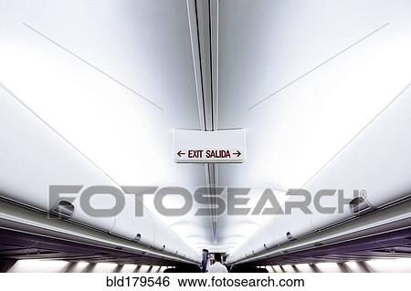 Exit sign in airplane View Large Photo Image Stock Photograph - Exit sign in airplane. Fotosearch