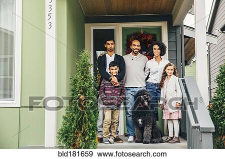 Family and dog smiling on patio View Large Photo Image Stock Photo - Family and dog smiling on patio. Fotosearch
