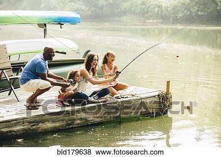 Stock Photo - Family fishing in lake. Fotosearch