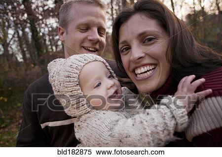 Stock Photography - Family laughing outdoors. Fotosearch
