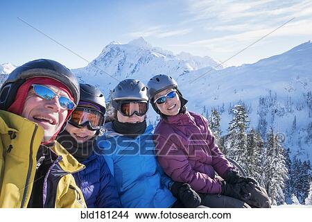 Family riding ski lift View Large Photo Image Picture - Family riding ski lift. Fotosearch