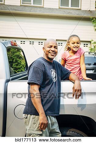 Father and daughter smiling in truck View Large Photo Image Stock Image - Father and daughter smiling in truck. Fotosearch