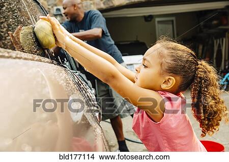 Father and daughter washing car View Large Photo Image Picture - Father and daughter washing car. Fotosearch