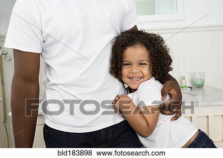 Father and son hugging in bathroom View Large Photo Image Stock Photo - Father and son hugging in bathroom. Fotosearch